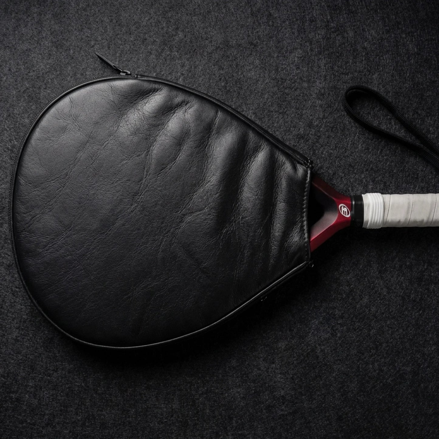 replace_the_background_with_a_premium_dark_black-grey_felt_surface_used_in_luxury_product_photograp_petga0q5u17rtiklbpsb